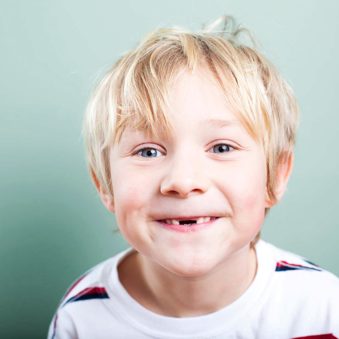 6-7 Years, 8-9 Years, Babies And Children, Blond Hair, Blue, Brightly Lit, Casual, Cheerful, Cheesy Grin, Child, Close-up, Copy Space, Cute, Elementary Age, Excitement, Gap, Happiness, Head And Shoulders, Horizontal, Human Teeth, Innocence, Isolated, Isolated Objects, Isolated On Blue, Lifestyle, Little Boys, Looking At Camera, Nerd, One Person, People, People, Portrait, Real People, Smiling, Toothless Smile, Turquoise