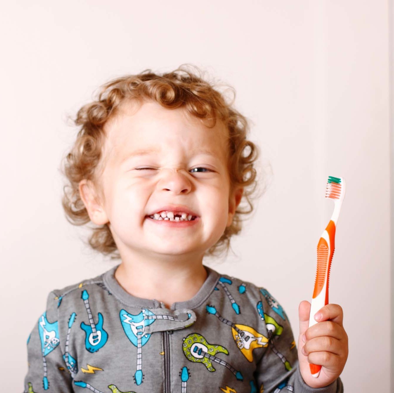 Cheesy Grin, Real People, Toddler, Preschool Age, Brushing Teeth, Bedtime, Morning, One Boy Only, Boys, Gap Toothed, Dental Health, Color Image, 15-18 Months, 2-3 Years, Child, Smiling, Getting Dressed, Caucasian Ethnicity, Preparation, Happiness, White, Looking At Camera, Horizontal, Cheerful, Blue Eyes, Human Teeth, Blond Hair, Curly Hair, Offspring, People, Night, Door, Domestic Bathroom, Toothbrush, Pajamas, Mirror, Lifestyle, People, Babies And Children
